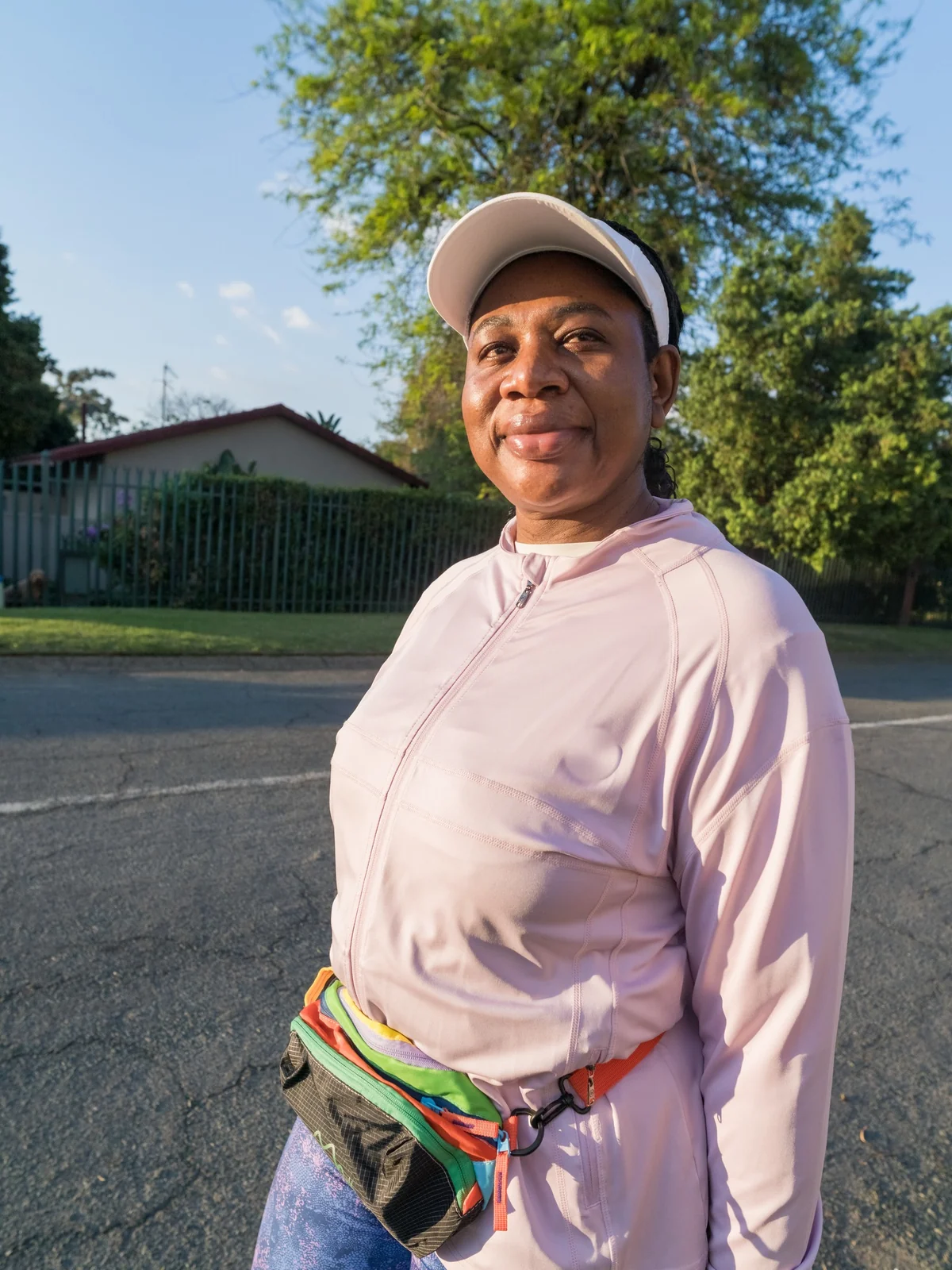 Mrs Ornica Mukhavhuli, Madam O, smiling in her walking kit.