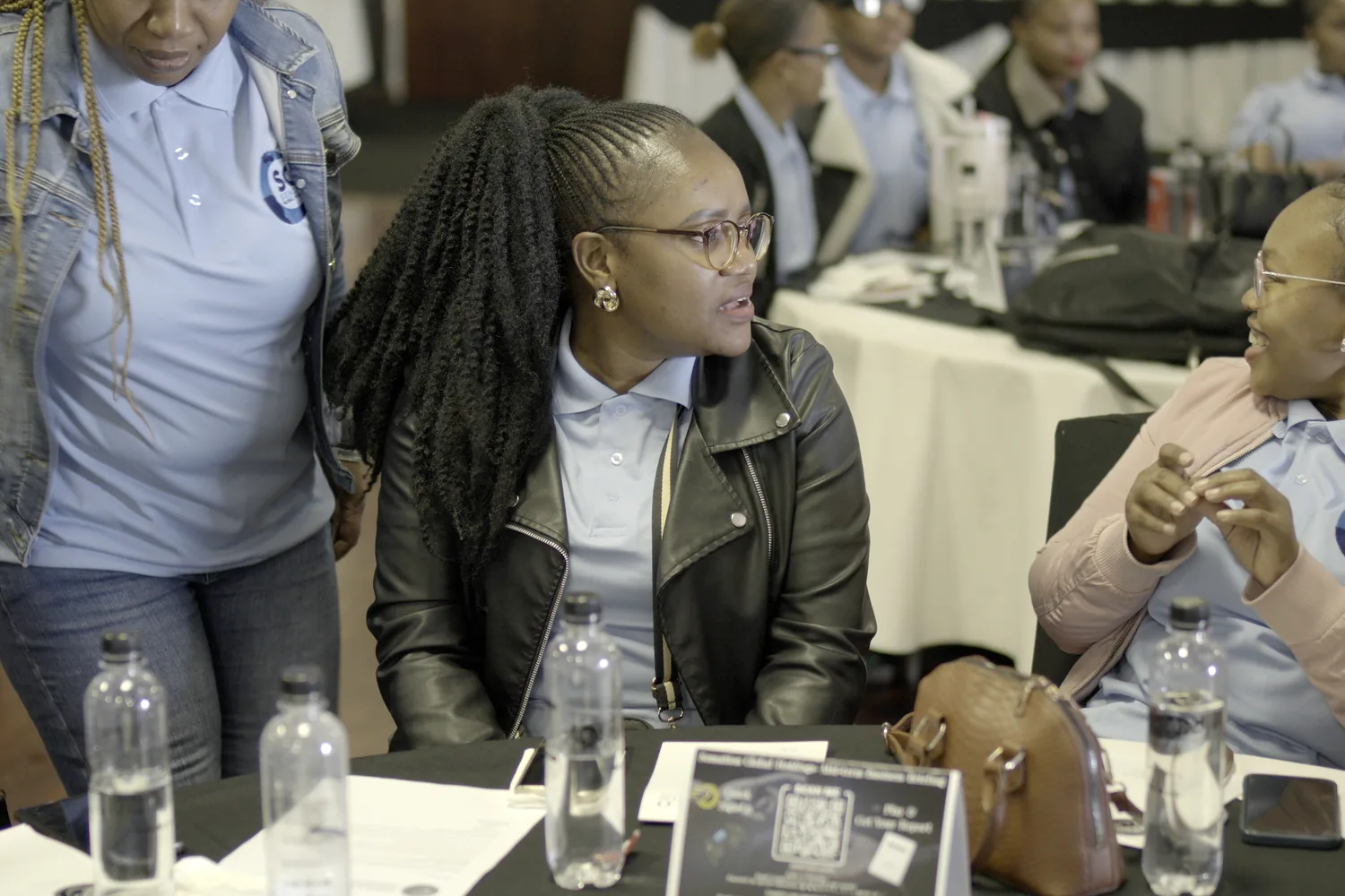 Sensation Global Holdings team members working together at a business briefing.